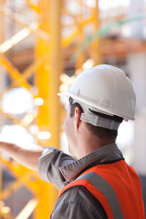 Construction workers working on construction site